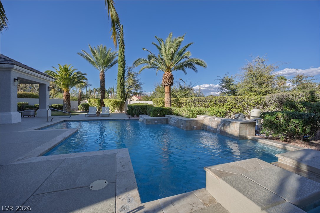 8800 Lusso Las Vegas, NV 89134 - Photo 11 of 85 View of swimming pool featuring patio surround and a fenced backyard