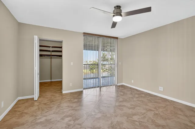 an empty room with a empty space and windows