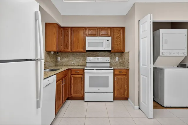 a kitchen with appliances cabinets and a counter top space