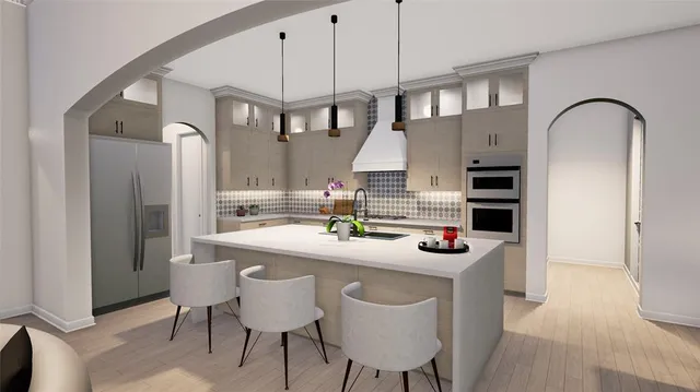 a kitchen with stainless steel appliances granite countertop a sink stove and refrigerator