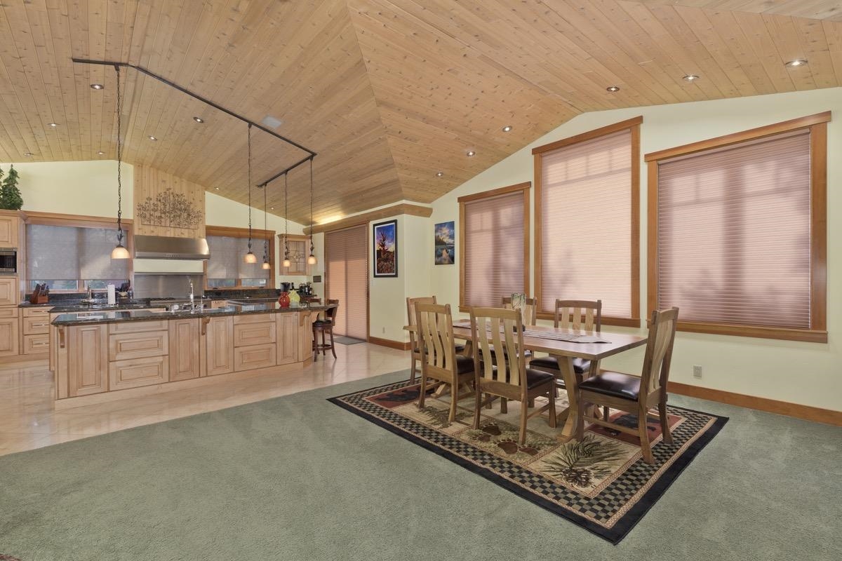 2500 Old Mammoth Road Mammoth Lakes, CA 93546 - Photo 15 of 48 a view of a kitchen with kitchen island granite countertop a large window in it