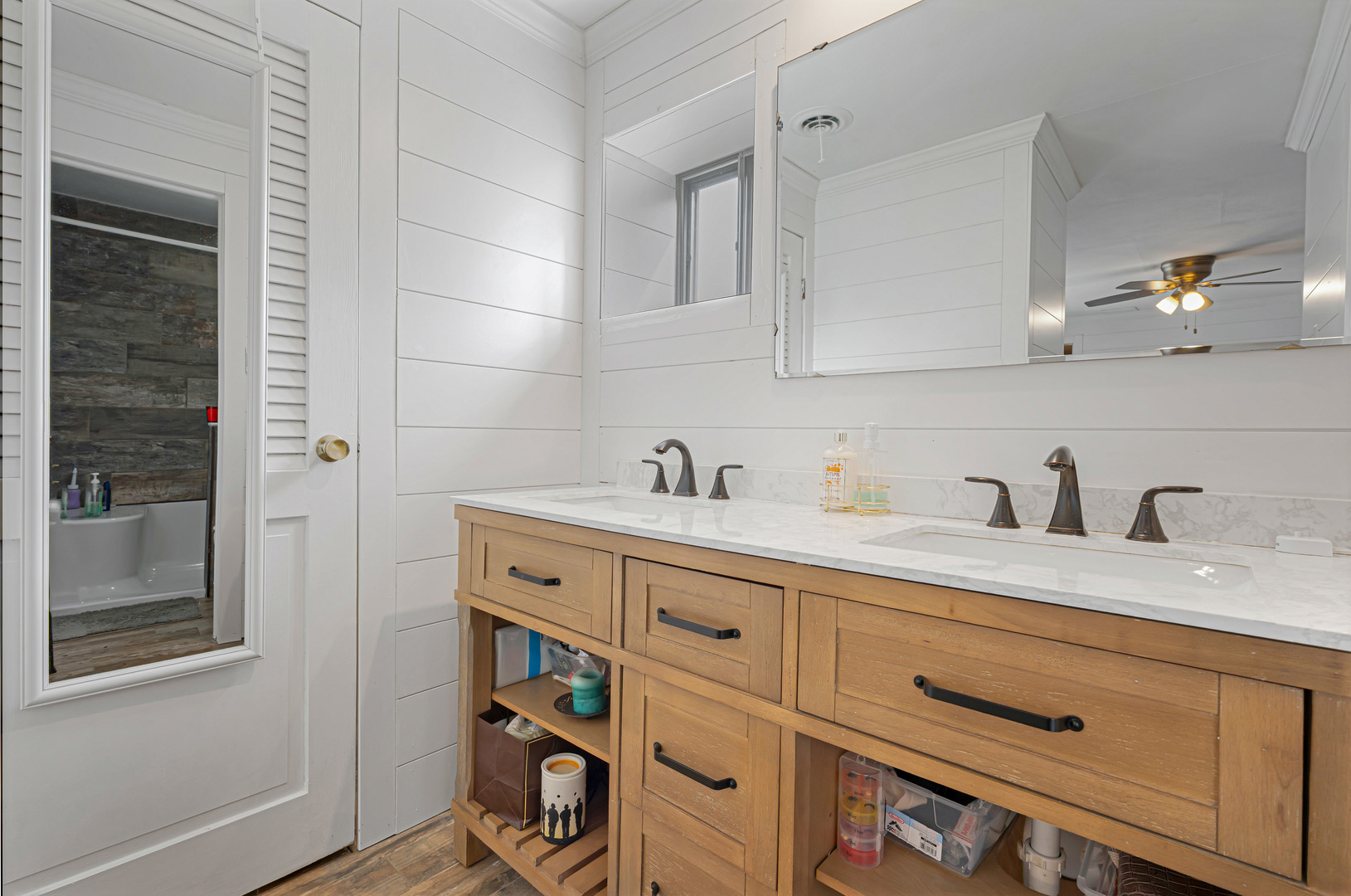 635 Springinsguth Road Schaumburg, IL 60193 - Photo 15 of 26 a spacious bathroom with a granite countertop sink and a mirror