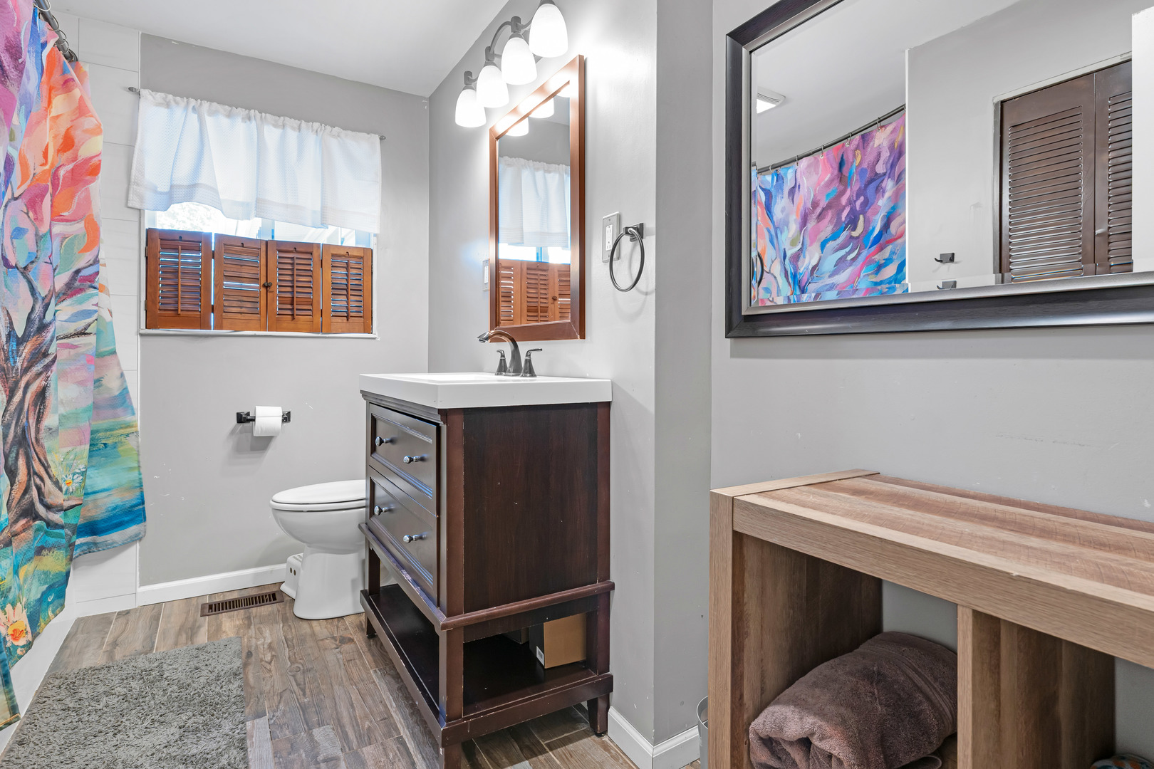 635 Springinsguth Road Schaumburg, IL 60193 - Photo 16 of 26 a bathroom with a toilet a sink and a mirror