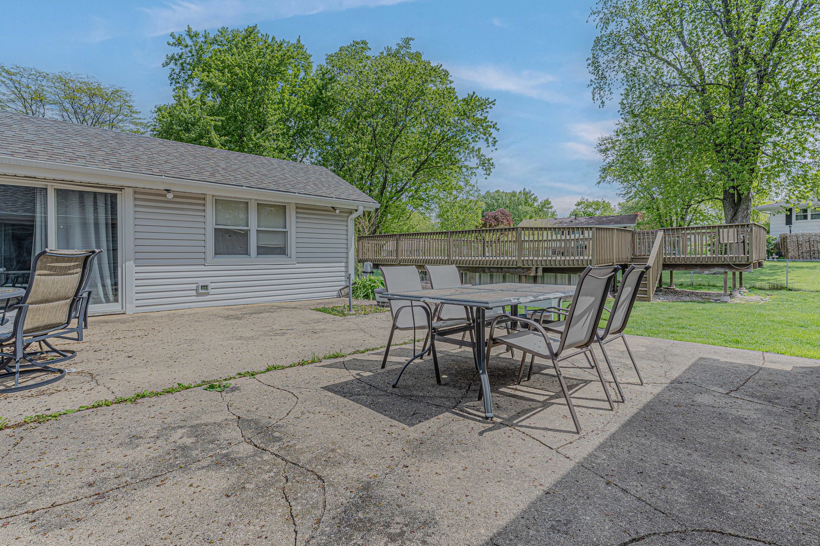 635 Springinsguth Road Schaumburg, IL 60193 - Photo 24 of 26 a view of a chairs and table in backyard of the house