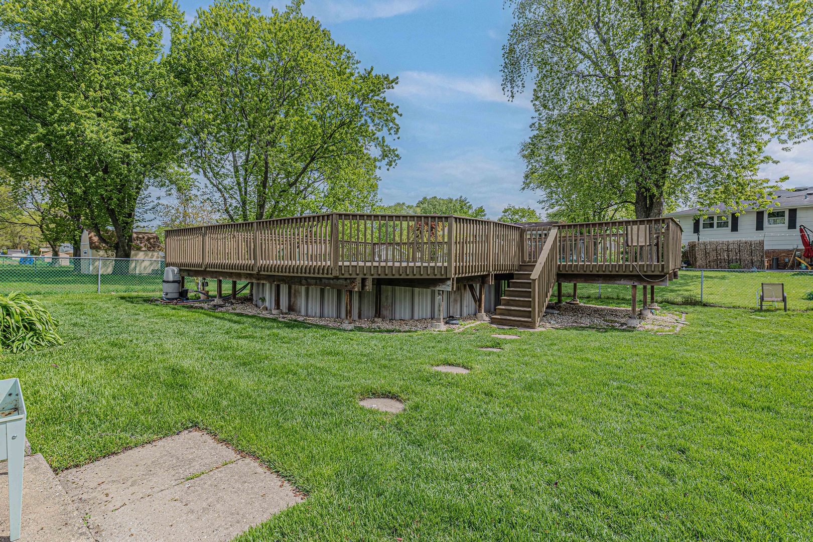 635 Springinsguth Road Schaumburg, IL 60193 - Photo 25 of 26 a view of a backyard with a garden and deck