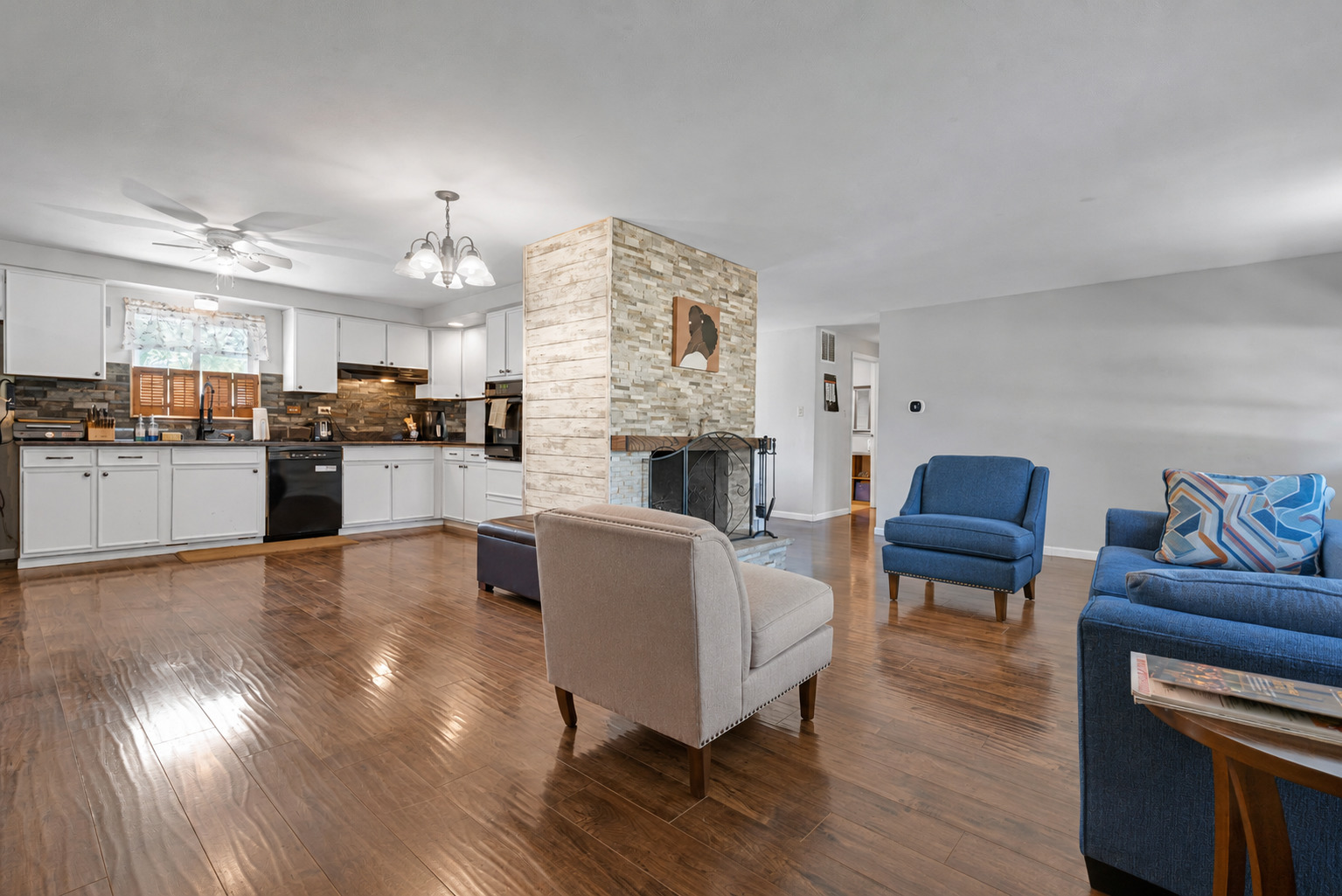 635 Springinsguth Road Schaumburg, IL 60193 - Photo 3 of 26 a living room with fireplace furniture and a wooden floor