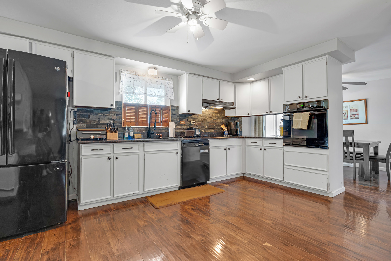 635 Springinsguth Road Schaumburg, IL 60193 - Photo 6 of 26 a kitchen with white cabinets and white appliances