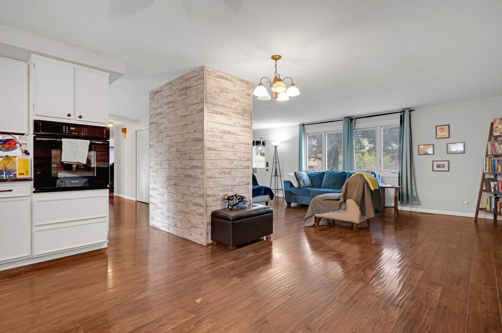 635 Springinsguth Road Schaumburg, IL 60193 - Photo 7 of 26 a living room with furniture and wooden floor
