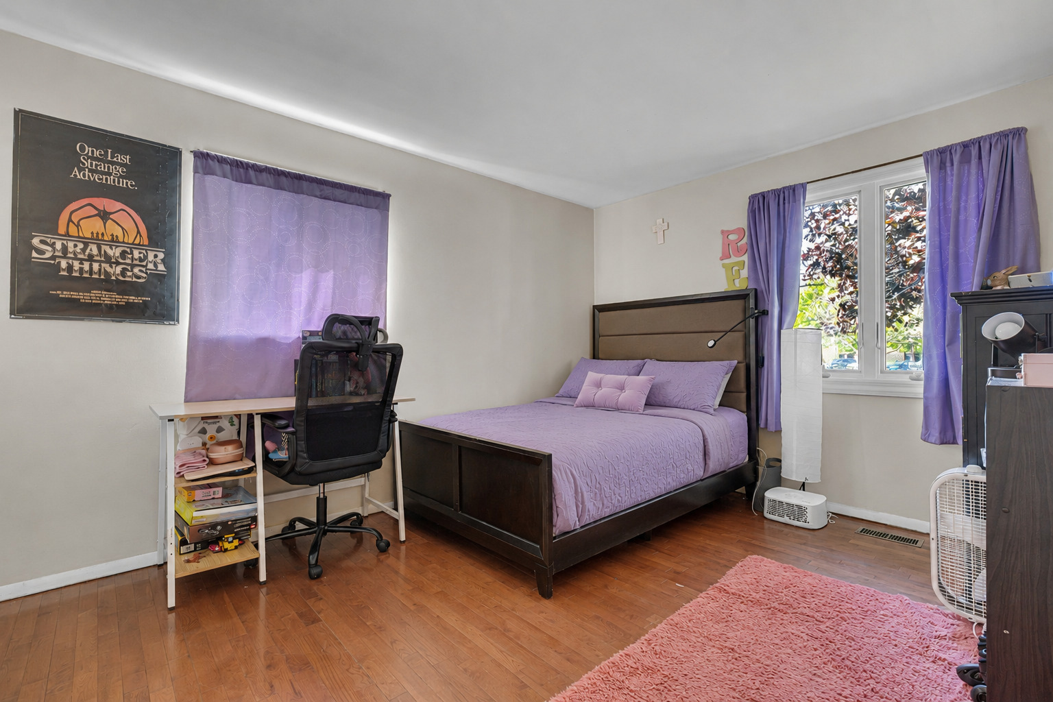 635 Springinsguth Road Schaumburg, IL 60193 - Photo 8 of 26 a bedroom with a bed and a window