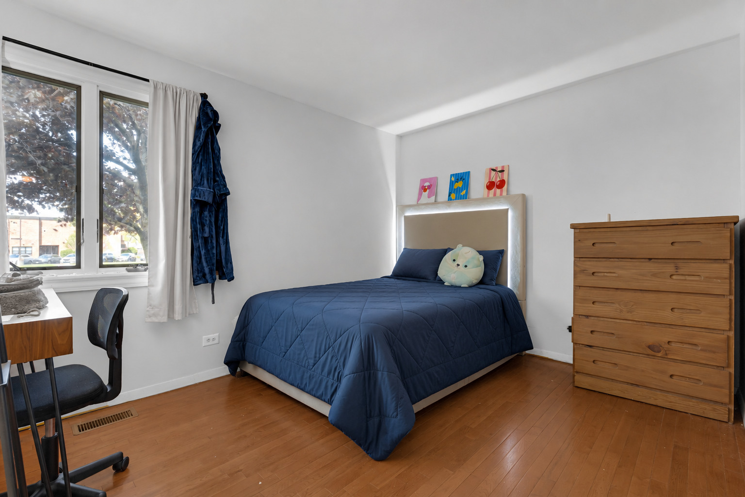 635 Springinsguth Road Schaumburg, IL 60193 - Photo 9 of 26 a bedroom with a bed and a window