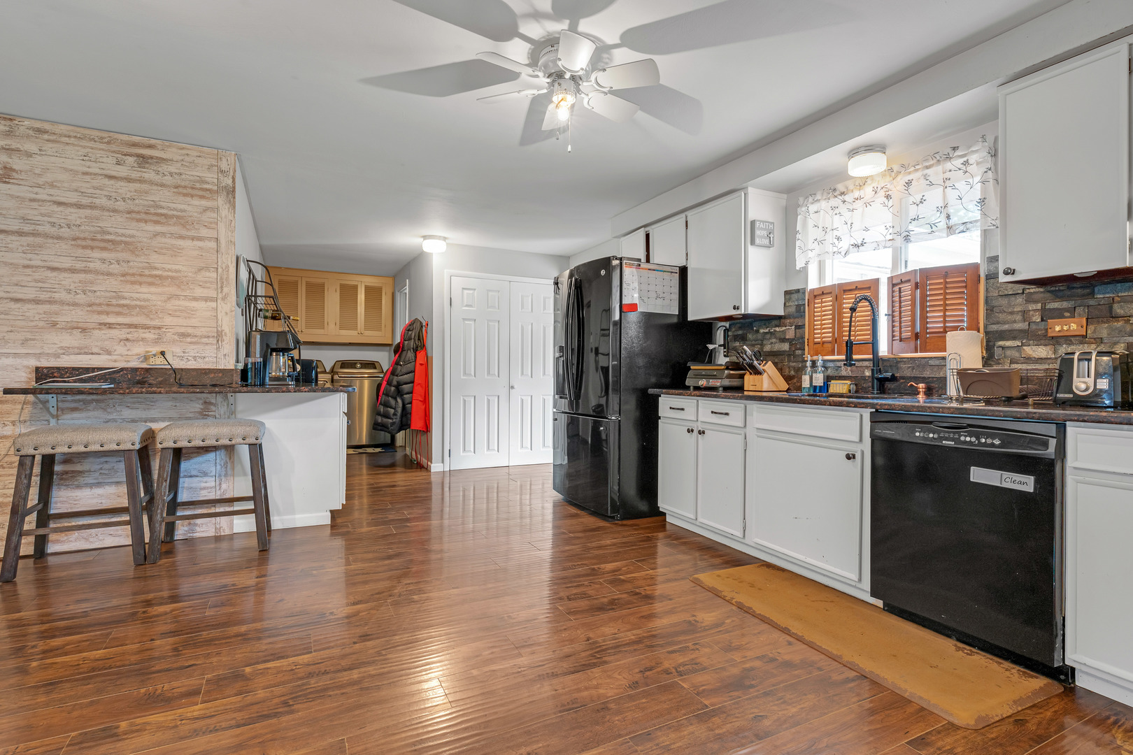 635 Springinsguth Road Schaumburg, IL 60193 - Photo 10 of 26 a kitchen with stainless steel appliances a stove top oven a sink dishwasher and a refrigerator
