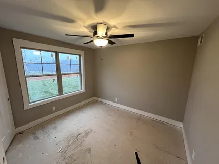 a spacious bathroom with a double vanity sink a mirror and a vanity