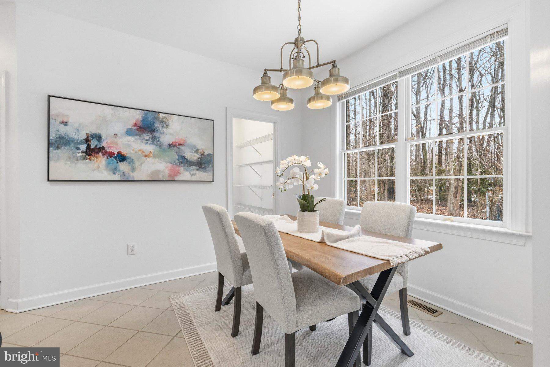 5375 Deale Churchton Road Churchton, MD 20733 - Photo 13 of 47 a view of a dining room with furniture a chandelier and a window