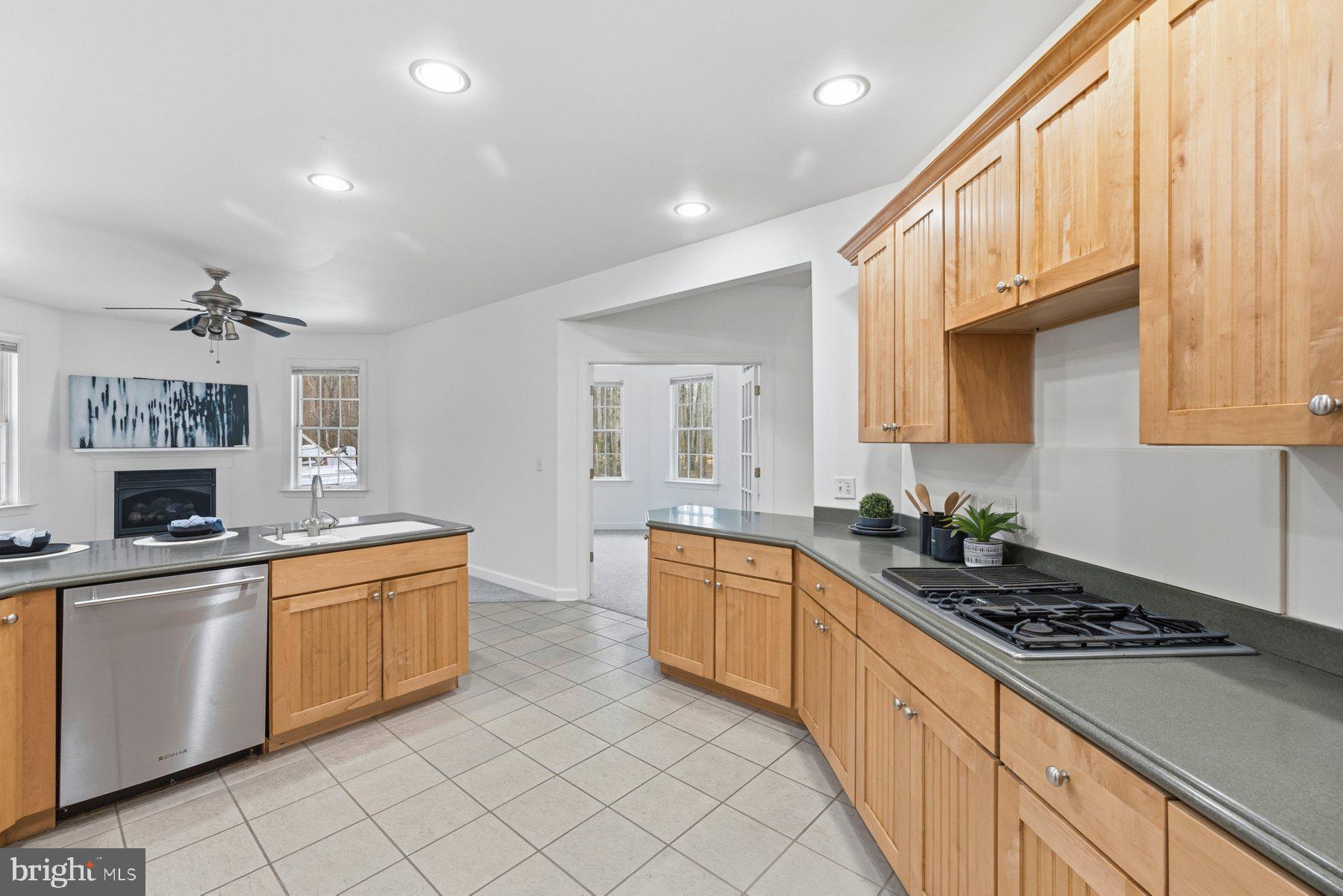 5375 Deale Churchton Road Churchton, MD 20733 - Photo 18 of 47 a kitchen with stainless steel appliances a sink stove and cabinets