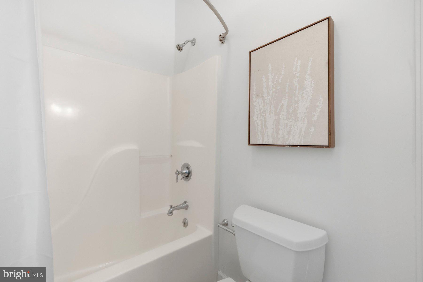 5375 Deale Churchton Road Churchton, MD 20733 - Photo 26 of 47 a white toilet sitting next to a bath tub shower