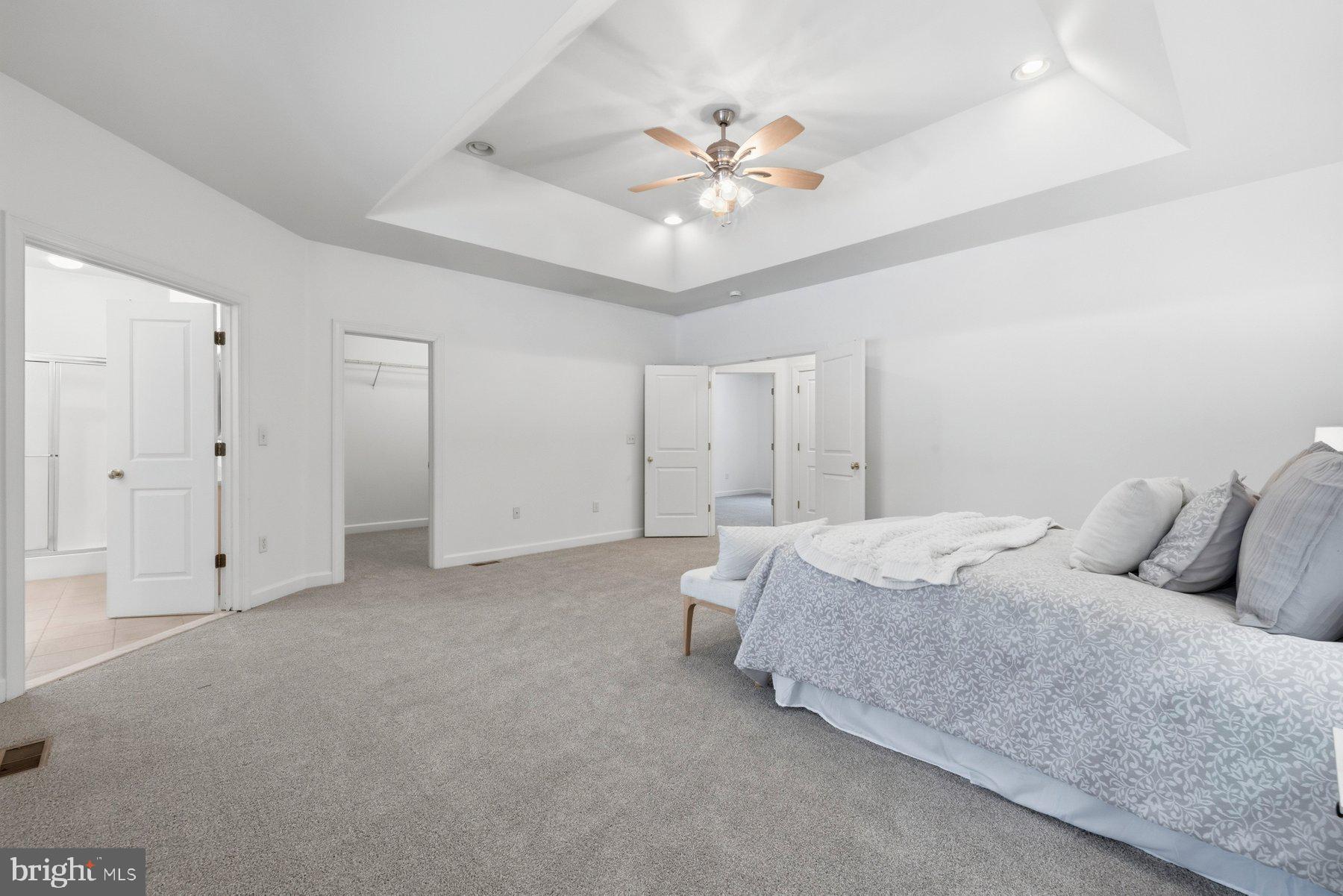 5375 Deale Churchton Road Churchton, MD 20733 - Photo 29 of 47 a bed room with a bed and a ceiling fan