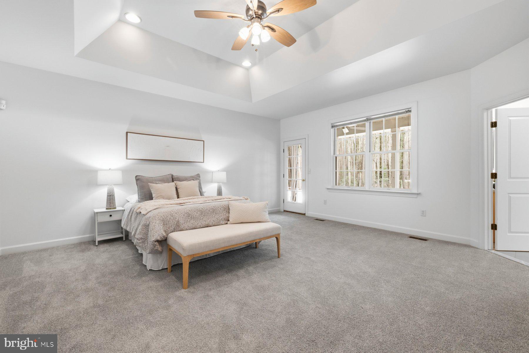 5375 Deale Churchton Road Churchton, MD 20733 - Photo 3 of 47 a bedroom with a bed and a chandelier