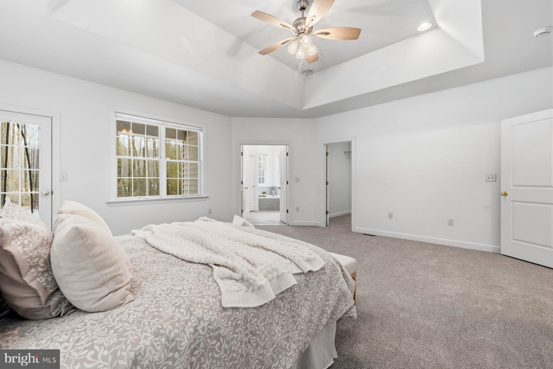5375 Deale Churchton Road Churchton, MD 20733 - Photo 4 of 47 a spacious bedroom with a large bed and ceiling fan