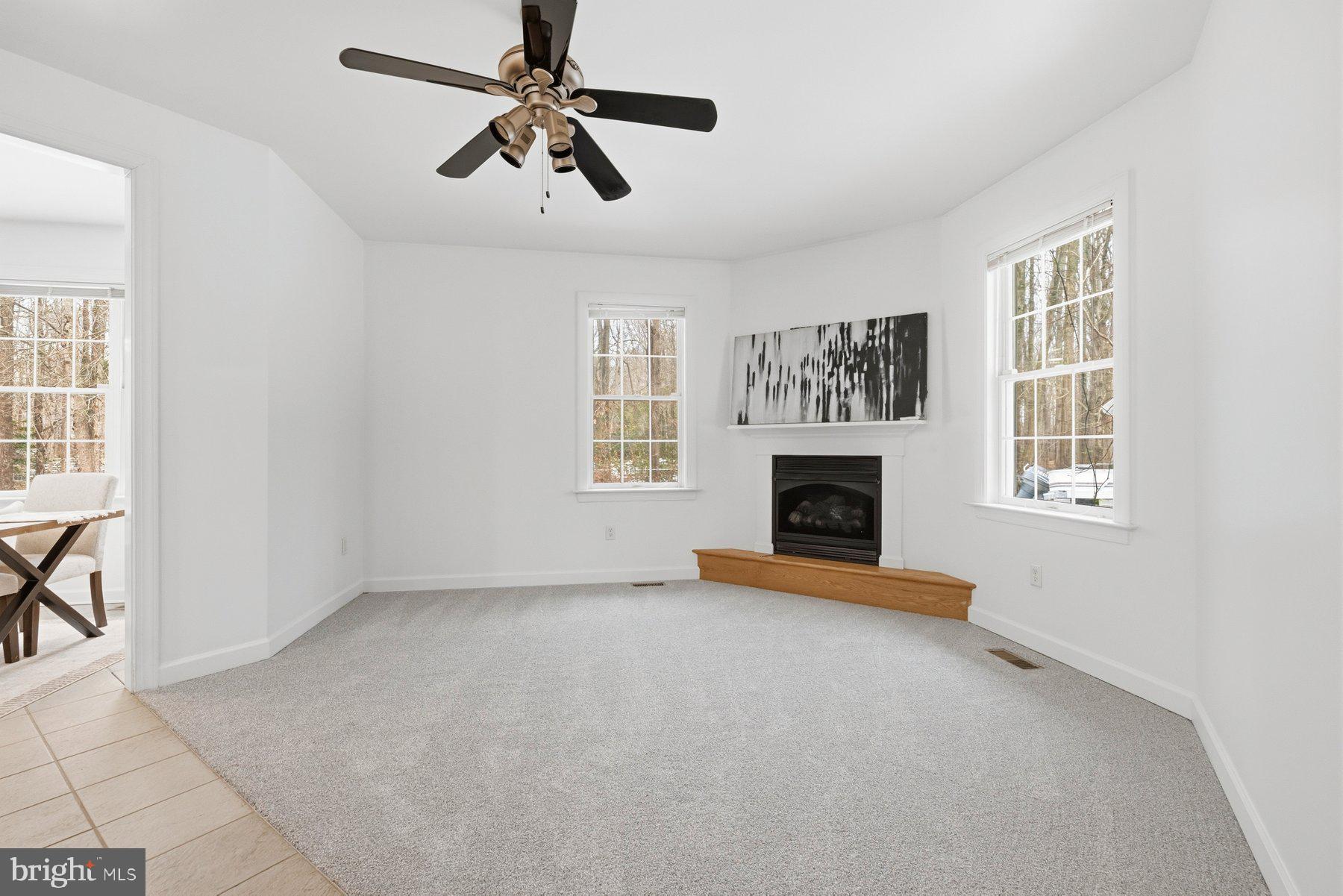 5375 Deale Churchton Road Churchton, MD 20733 - Photo 5 of 47 an empty room with windows and fireplace
