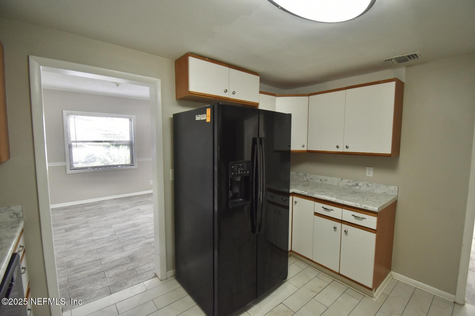5102 Lambing Road Jacksonville, FL 32210 - Photo 11 of 25 a kitchen with stainless steel appliances granite countertop a refrigerator and a stove