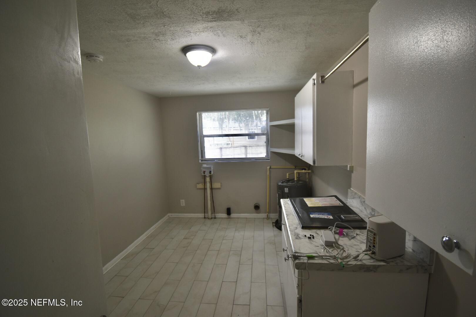 5102 Lambing Road Jacksonville, FL 32210 - Photo 14 of 25 a room with furniture and a window