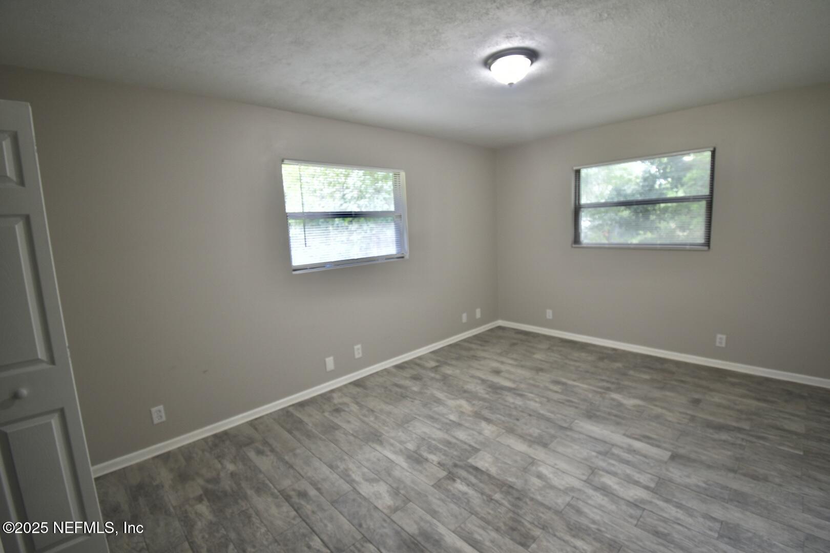 5102 Lambing Road Jacksonville, FL 32210 - Photo 15 of 25 an empty room with a window