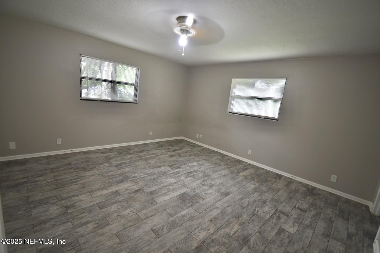 5102 Lambing Road Jacksonville, FL 32210 - Photo 18 of 25 a view of empty room with windows
