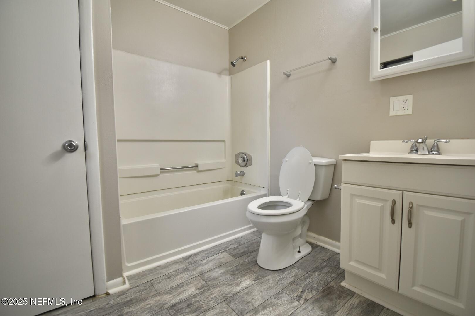 5102 Lambing Road Jacksonville, FL 32210 - Photo 19 of 25 a bathroom with a toilet sink and shower