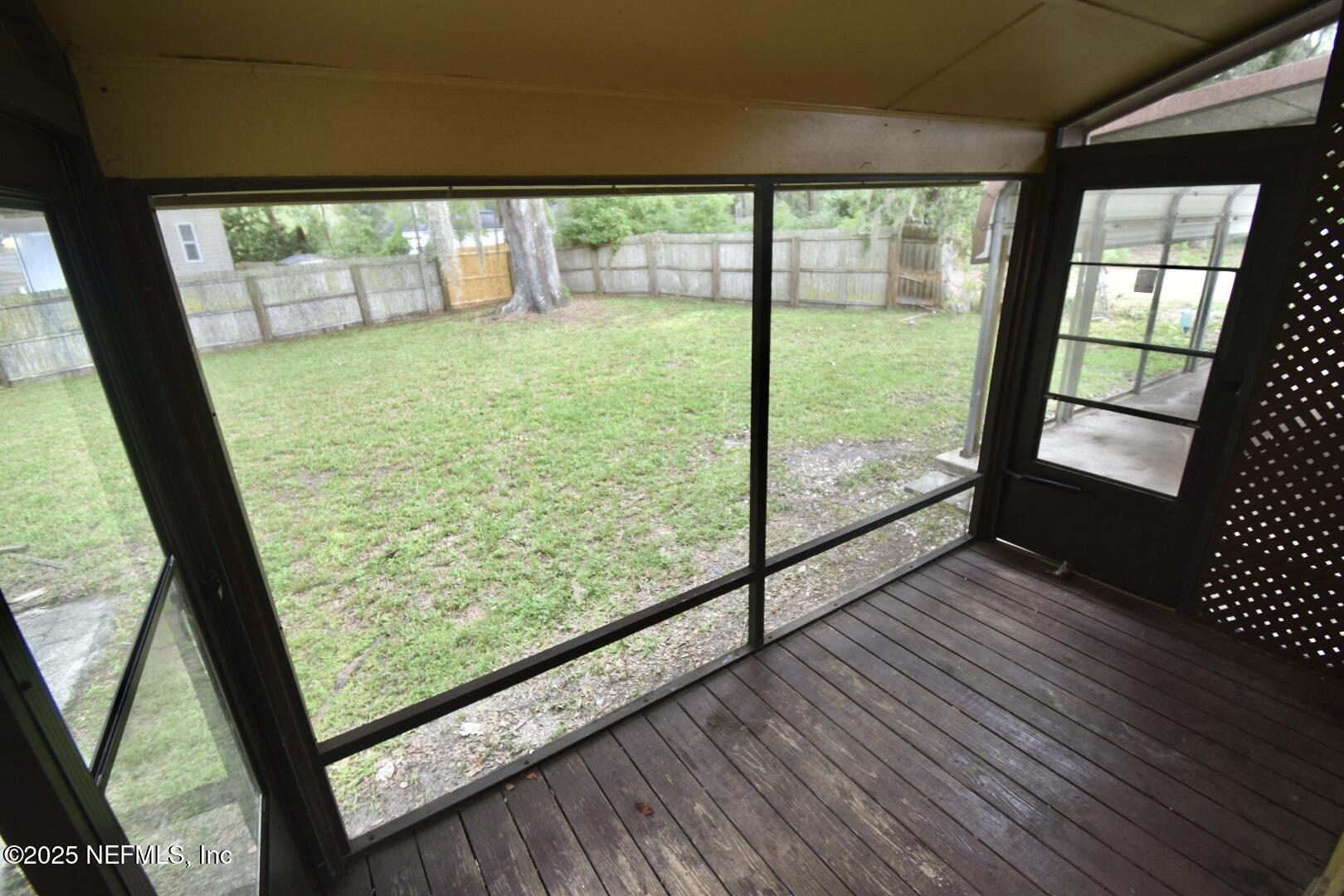 5102 Lambing Road Jacksonville, FL 32210 - Photo 20 of 25 a view of a porch with wooden floor and outdoor space