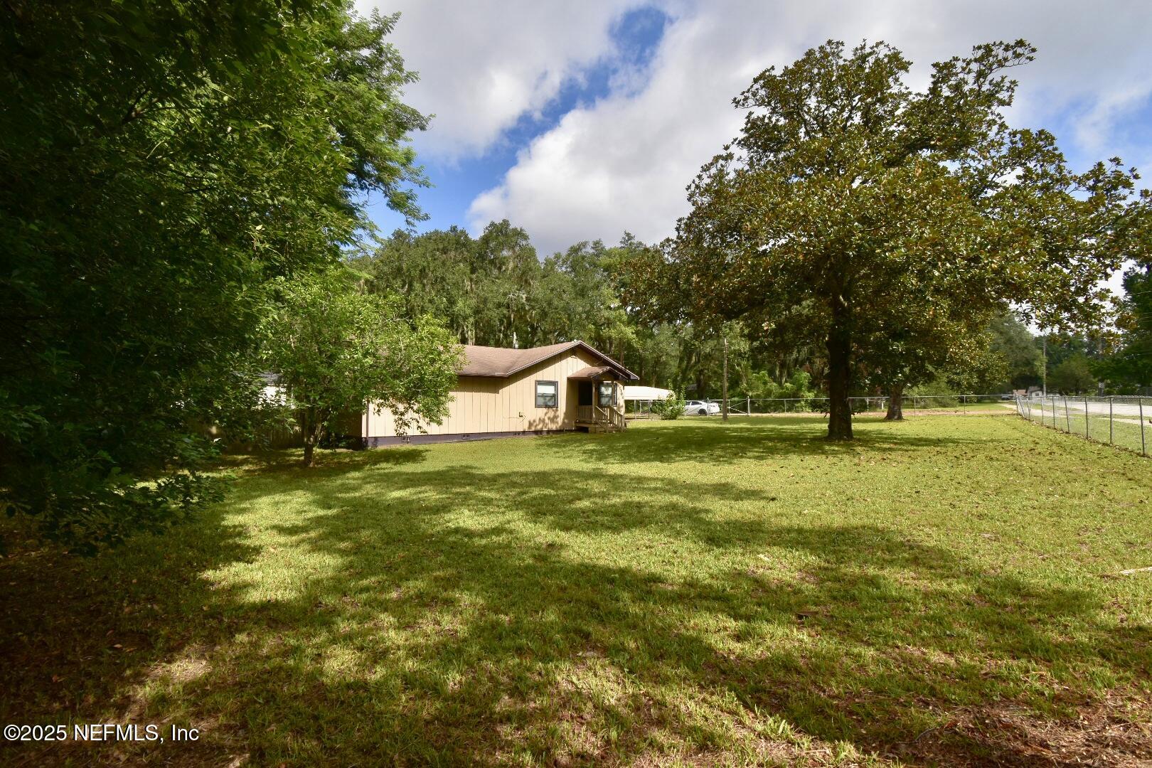 5102 Lambing Road Jacksonville, FL 32210 - Photo 2 of 25 a view of a tree in a yard