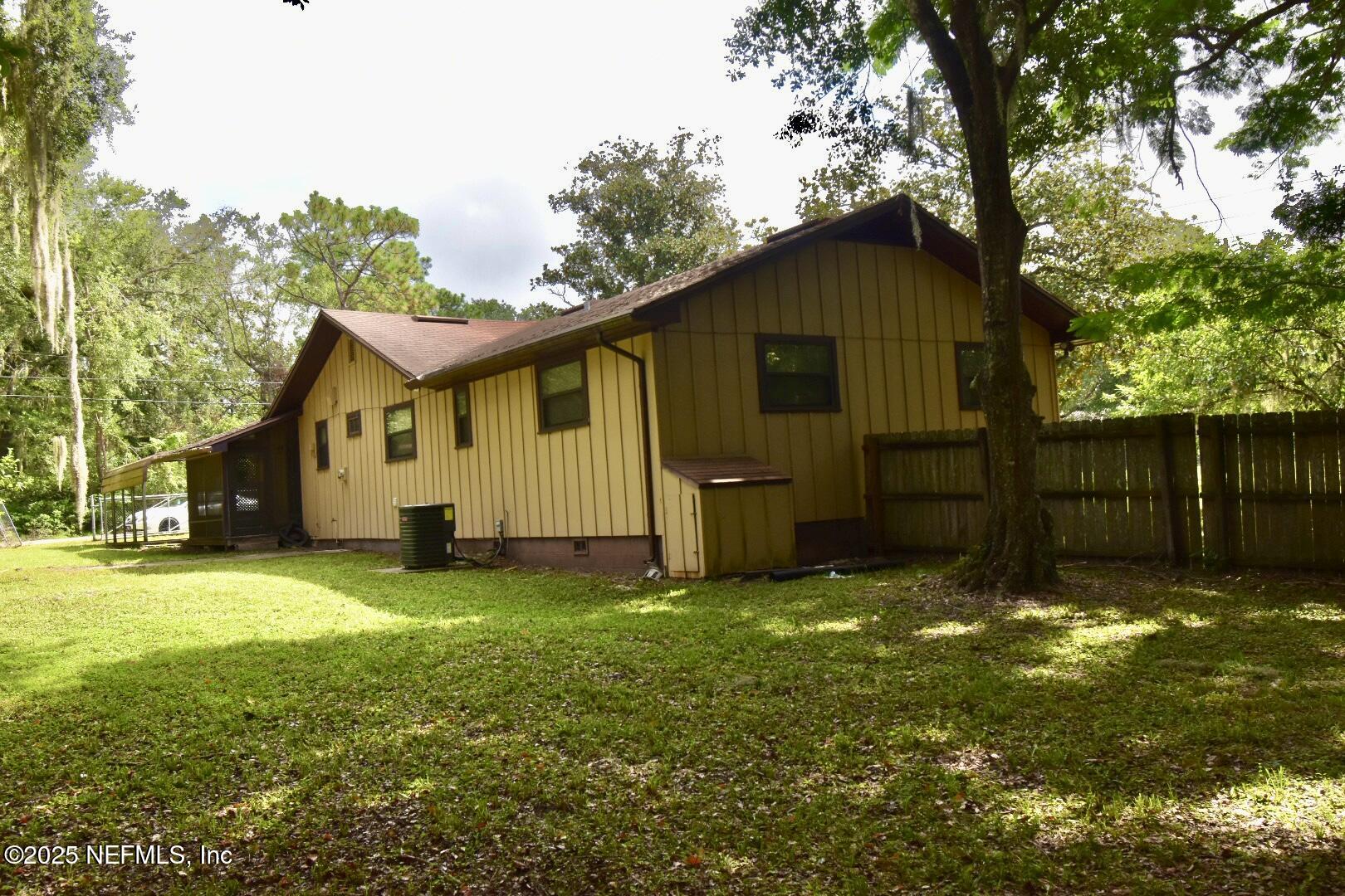 5102 Lambing Road Jacksonville, FL 32210 - Photo 23 of 25 a view of a house with a yard