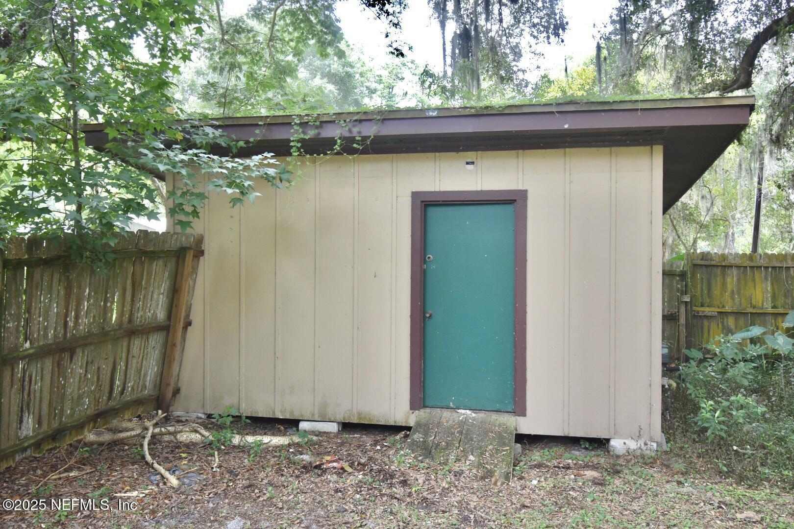 5102 Lambing Road Jacksonville, FL 32210 - Photo 25 of 25 a view of a house with a yard