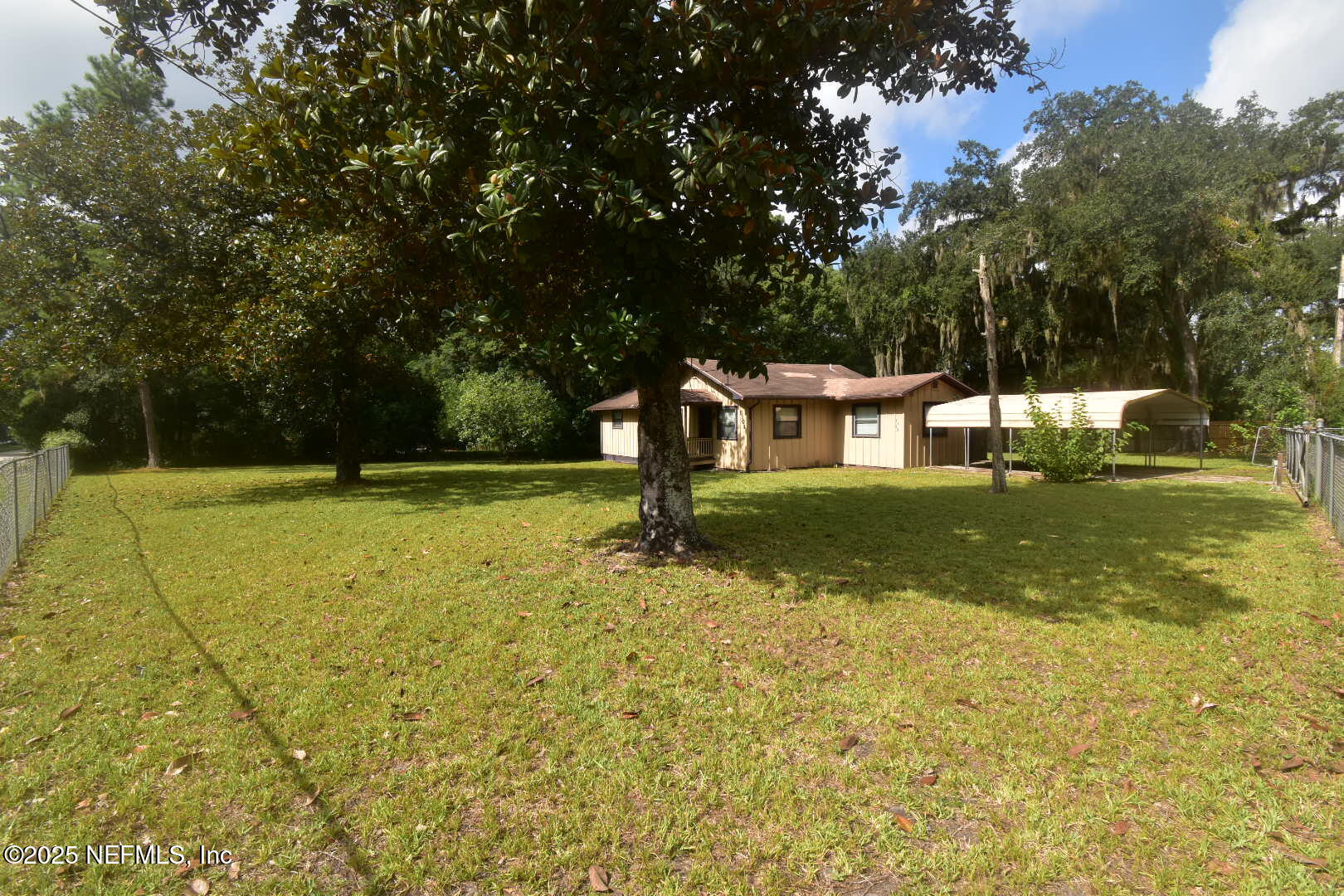 5102 Lambing Road Jacksonville, FL 32210 - Photo 4 of 25 a view of a house with a yard
