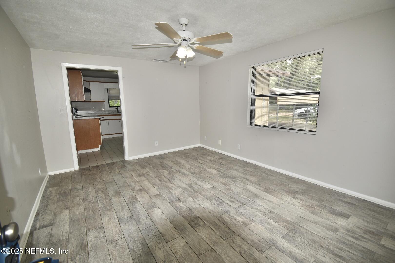 5102 Lambing Road Jacksonville, FL 32210 - Photo 8 of 25 a view of an empty room with a window