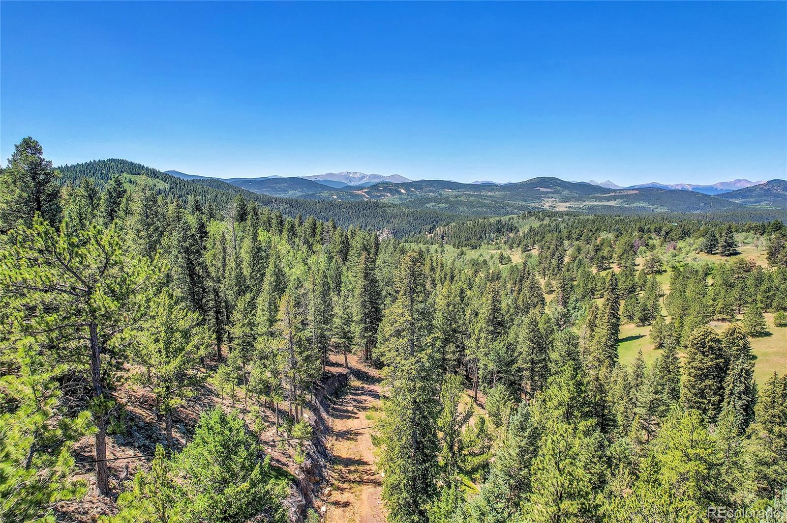 5 Hughesville Road Black Hawk, CO 80422 - Photo 9 of 17 a view of a city with lush green forest