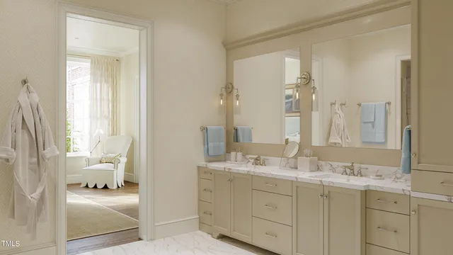 a en suite bathroom with a double vanity sink and a mirror