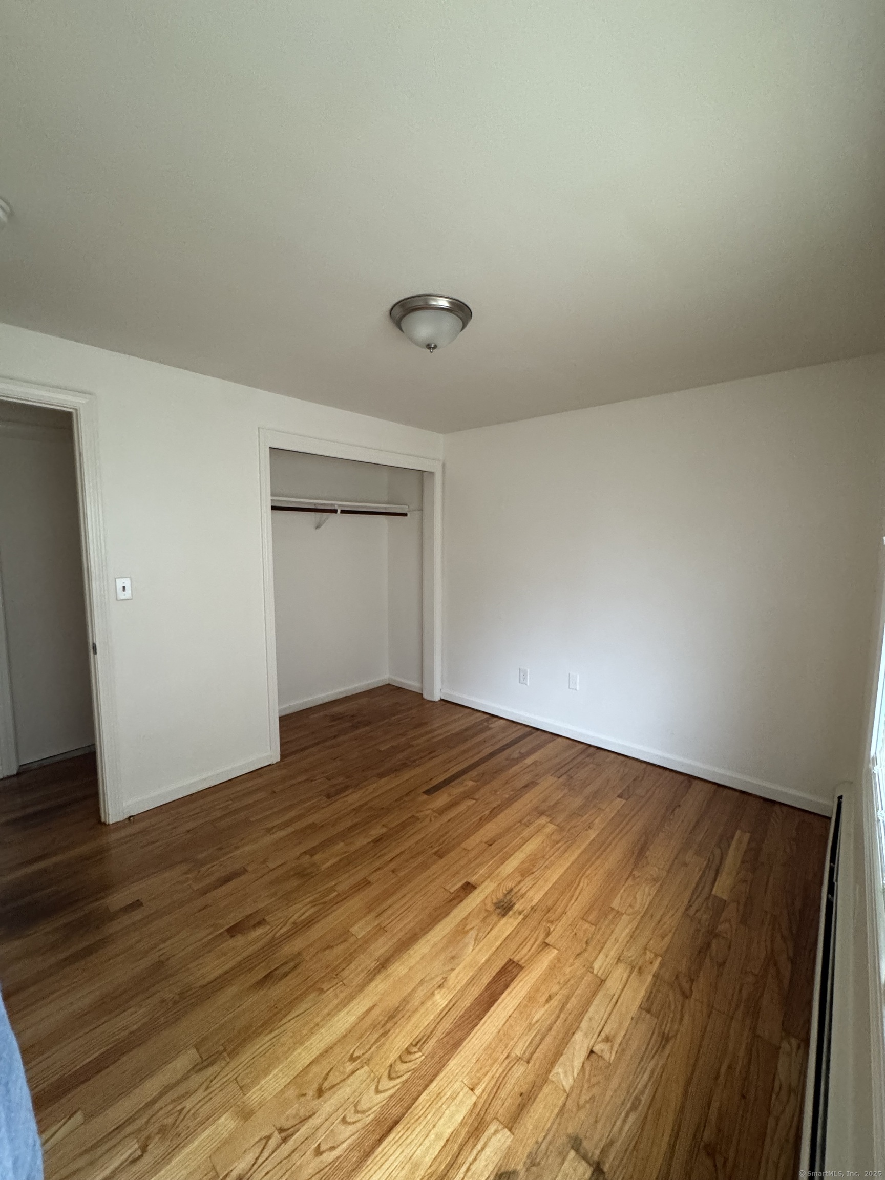 68 Warner Street, Unit B2 Hamden, CT 06514 - Photo 4 of 6 a view of empty room with wooden floor