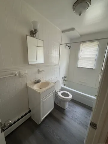 a bathroom with a sink a bathtub and a shower