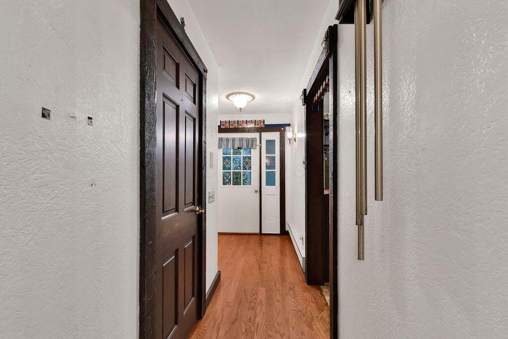 4409 Newton Road Northeast Newark, OH 43055 - Photo 9 of 87 • Wood flooring • Venetian plaster walls • Ceiling light • Lighted coat closet