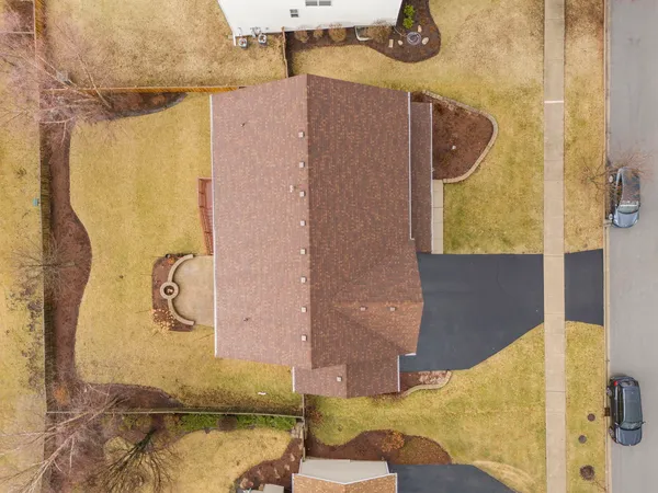 an aerial view of residential houses with outdoor space