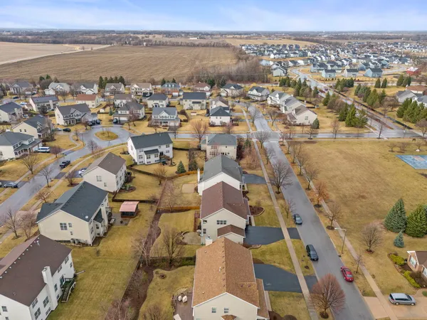 an aerial view of residential building with parking
