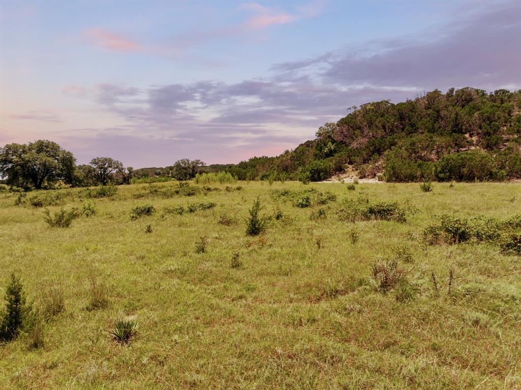 5777 County Road 309 Cranfills Gap, TX 76637 - Photo 1 of 1 a view of a houses with a lake in the background