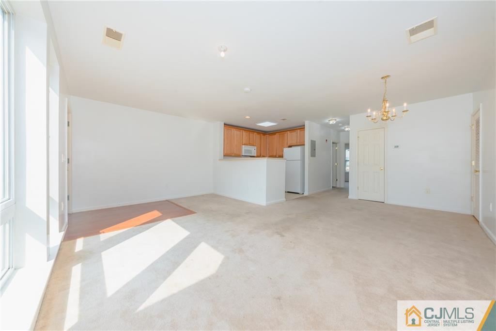 368 Rector Street, Unit 411 Perth Amboy, NJ 08861 - Photo 4 of 14 a view of a room with a kitchen