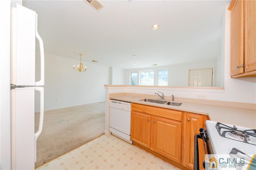 368 Rector Street, Unit 411 Perth Amboy, NJ 08861 - Photo 8 of 14 a bathroom with a sink a vanity and mirror