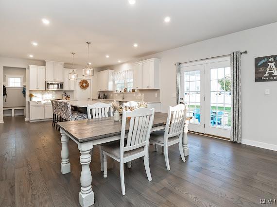 4020 Walter Road Bethlehem, PA 18020 - Photo 14 of 54 a dining room with stainless steel appliances furniture a wooden floor and a kitchen view