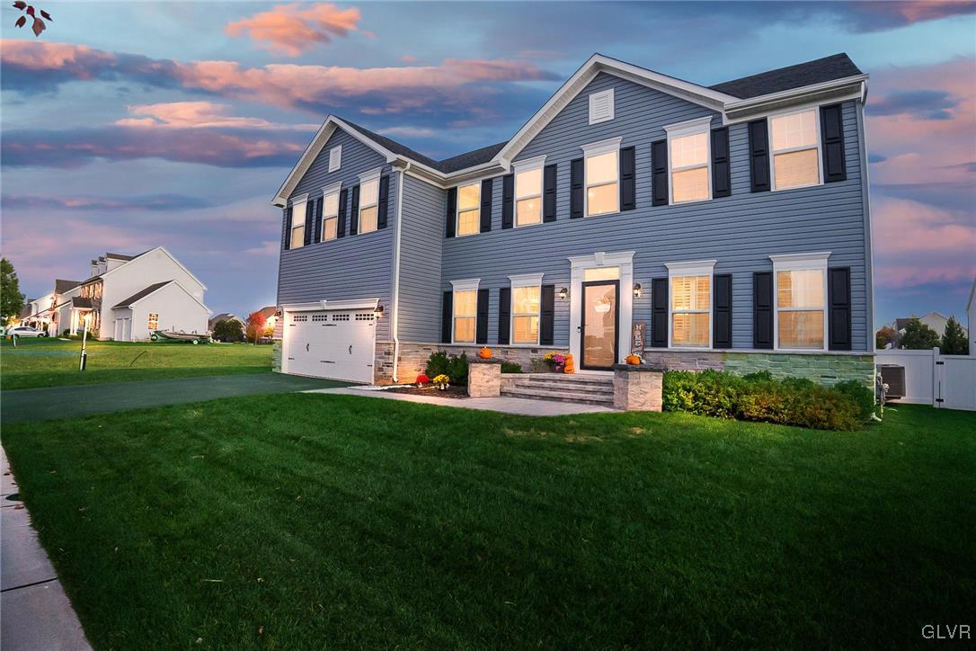 4020 Walter Road Bethlehem, PA 18020 - Photo 2 of 54 a front view of a house with a garden and trees
