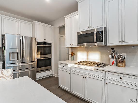 4020 Walter Road Bethlehem, PA 18020 - Photo 22 of 54 a kitchen with granite countertop a refrigerator stove and microwave