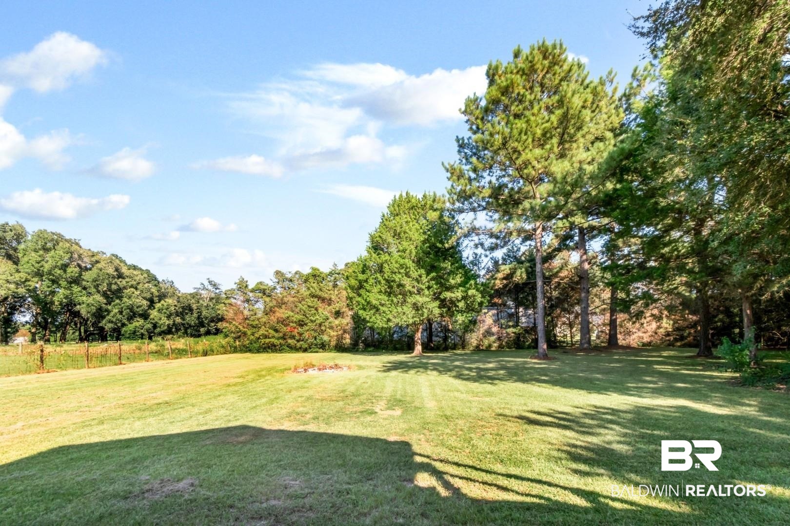 1360 Dykes Road North Mobile, AL 36608 - Photo 37 of 40 View of grassy yard featuring view of scattered trees
