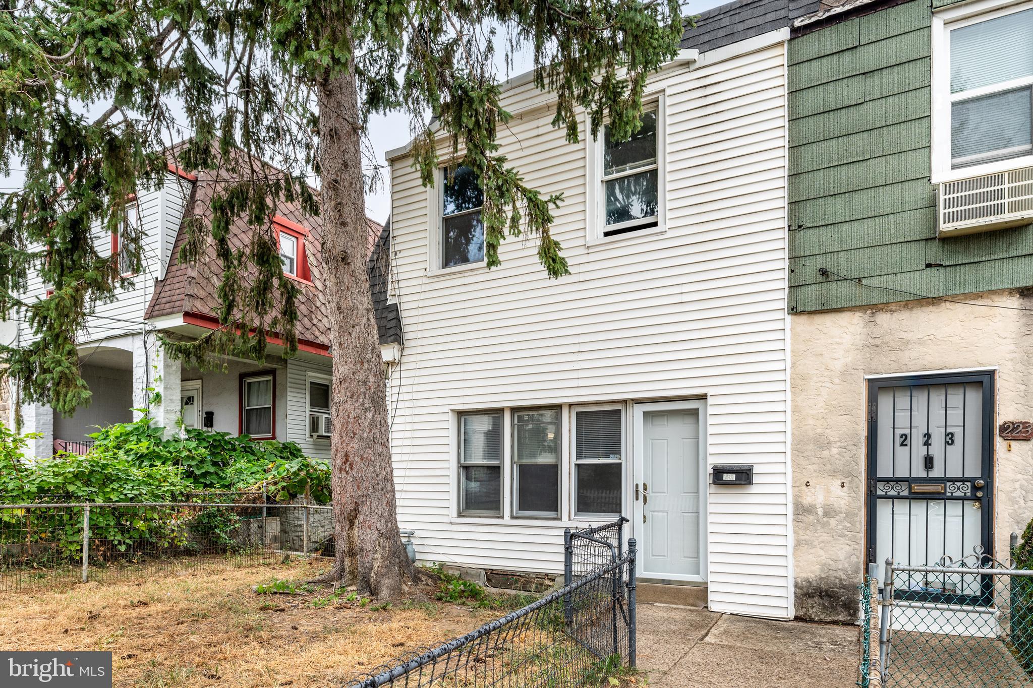 221 Barrington Road Upper Darby, PA 19082 - Photo 1 of 29 a house that has a tree in front of the house