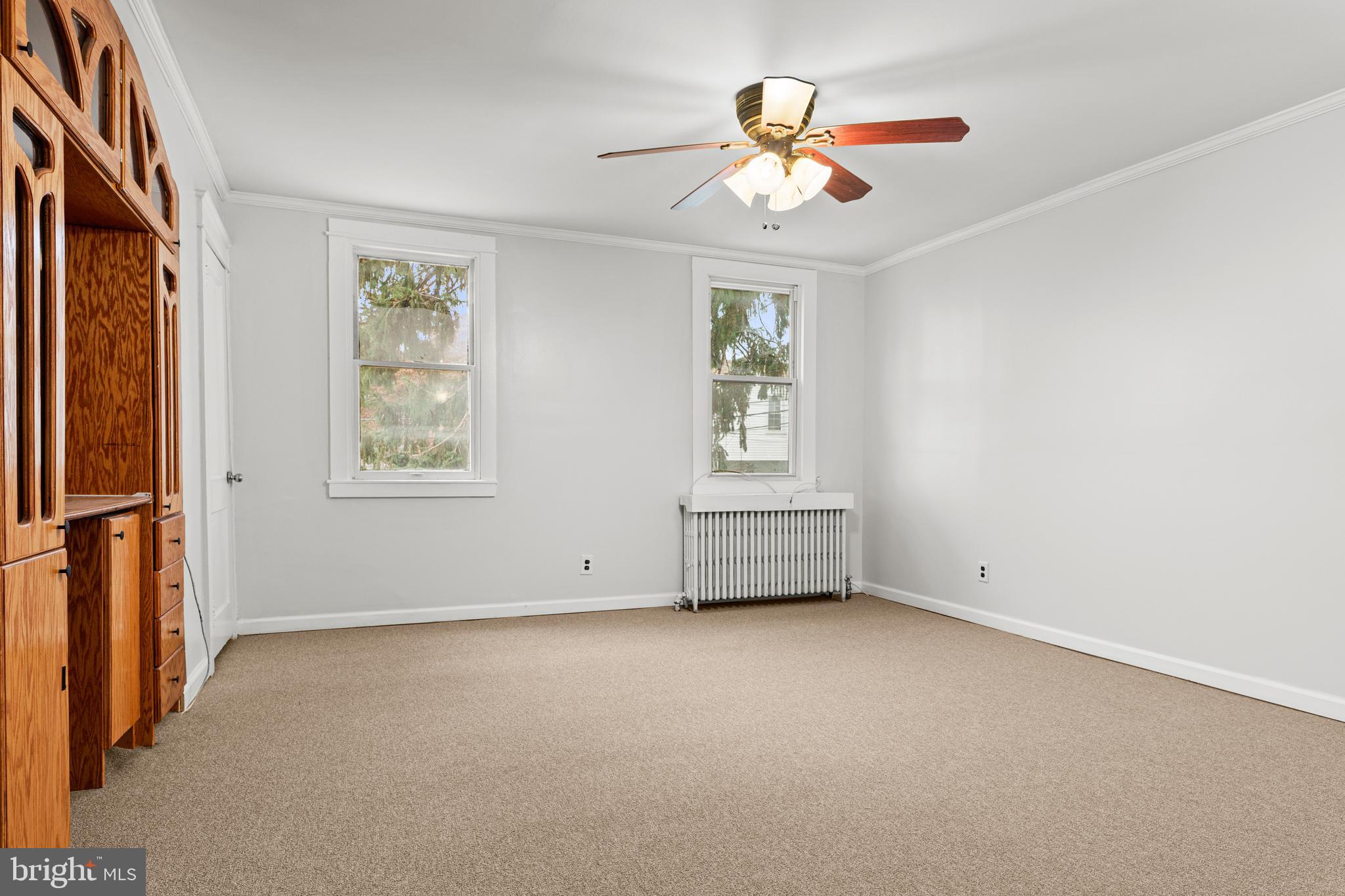 221 Barrington Road Upper Darby, PA 19082 - Photo 15 of 29 an empty room with windows and fan